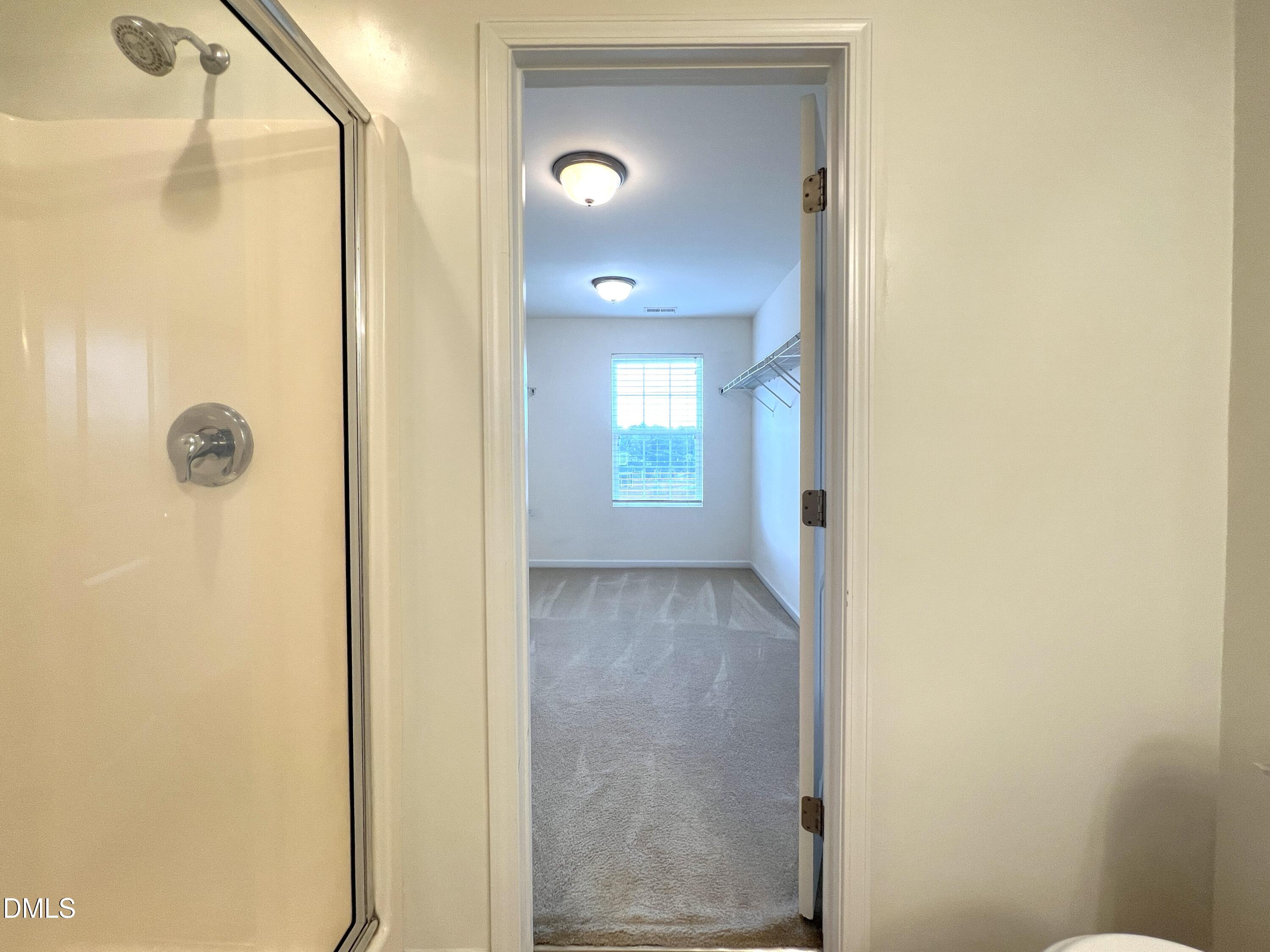 1495 Willowcrest Road Durham, NC 27703 - Photo 22 of 35 a view of a hallway with a glass door and a window