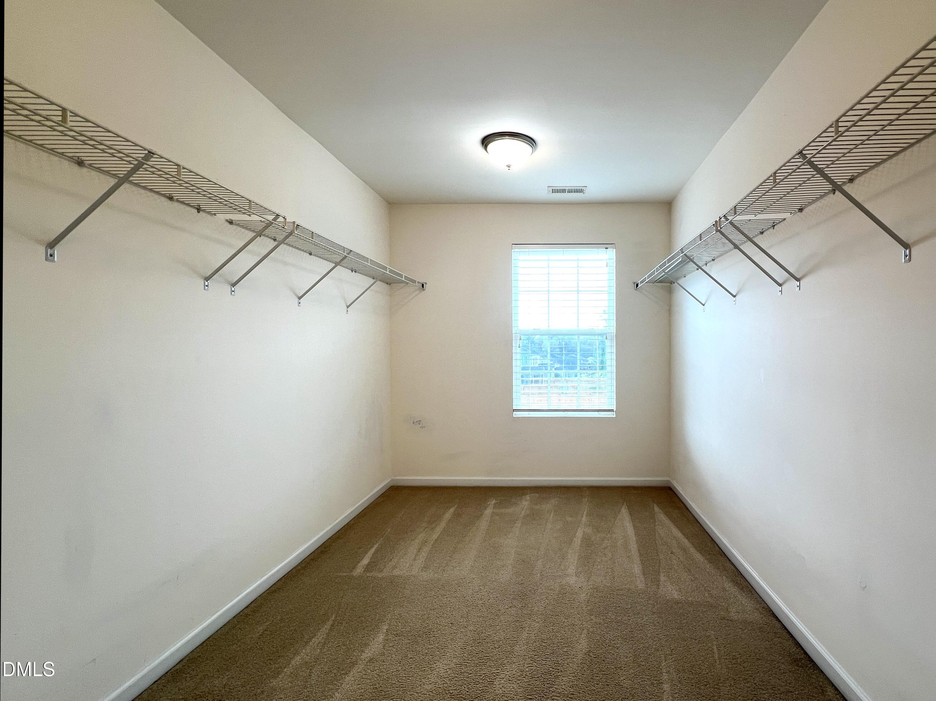 1495 Willowcrest Road Durham, NC 27703 - Photo 23 of 35 a view of a room with rack on the wall and a window