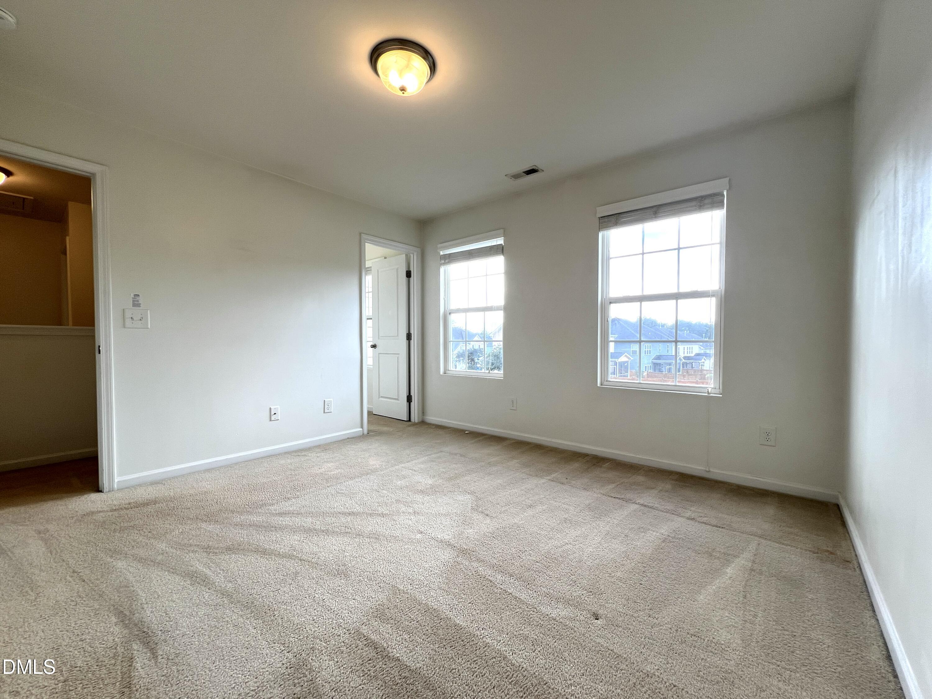 1495 Willowcrest Road Durham, NC 27703 - Photo 27 of 35 an empty room with windows