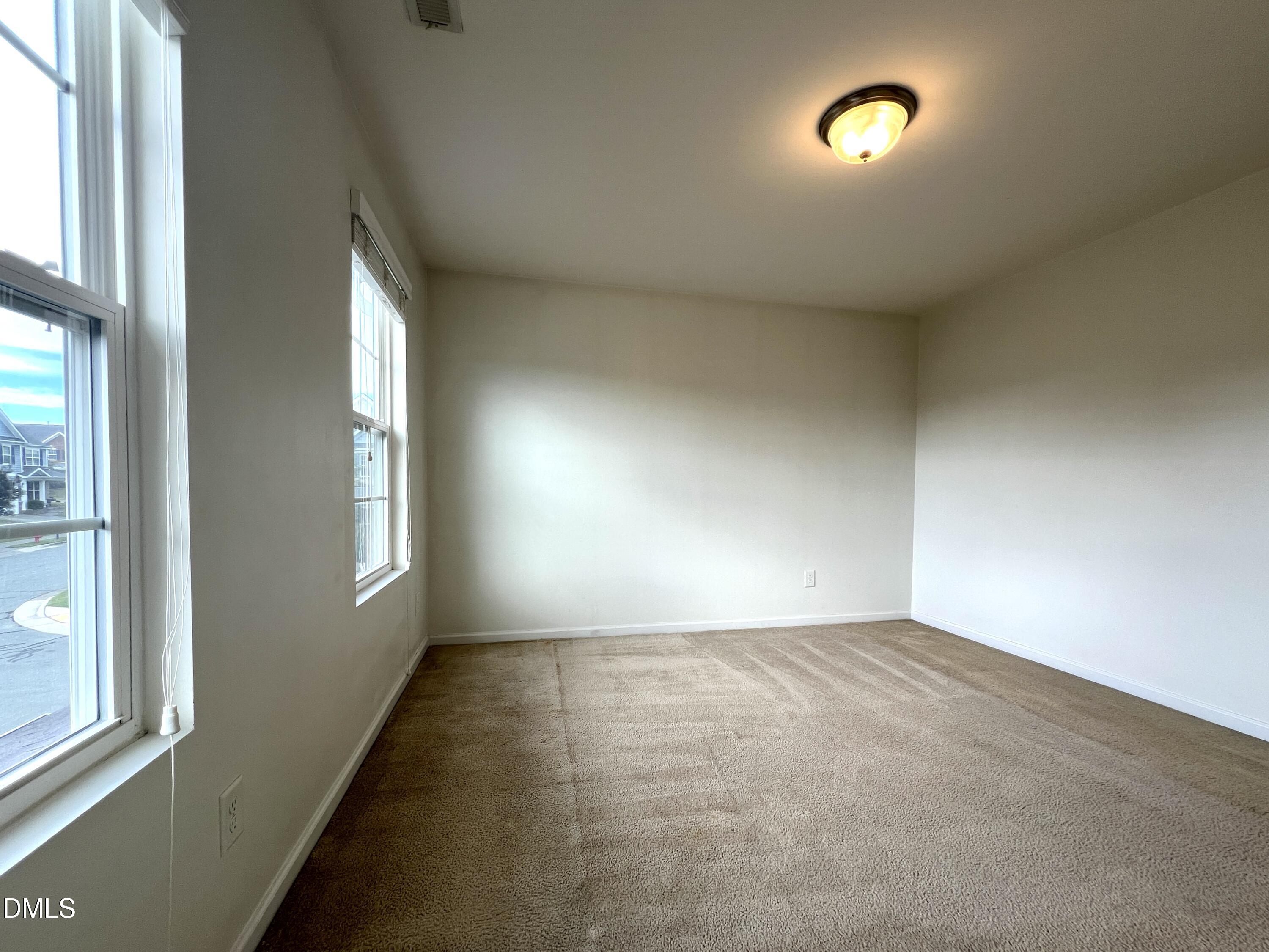 1495 Willowcrest Road Durham, NC 27703 - Photo 29 of 35 an empty room with windows