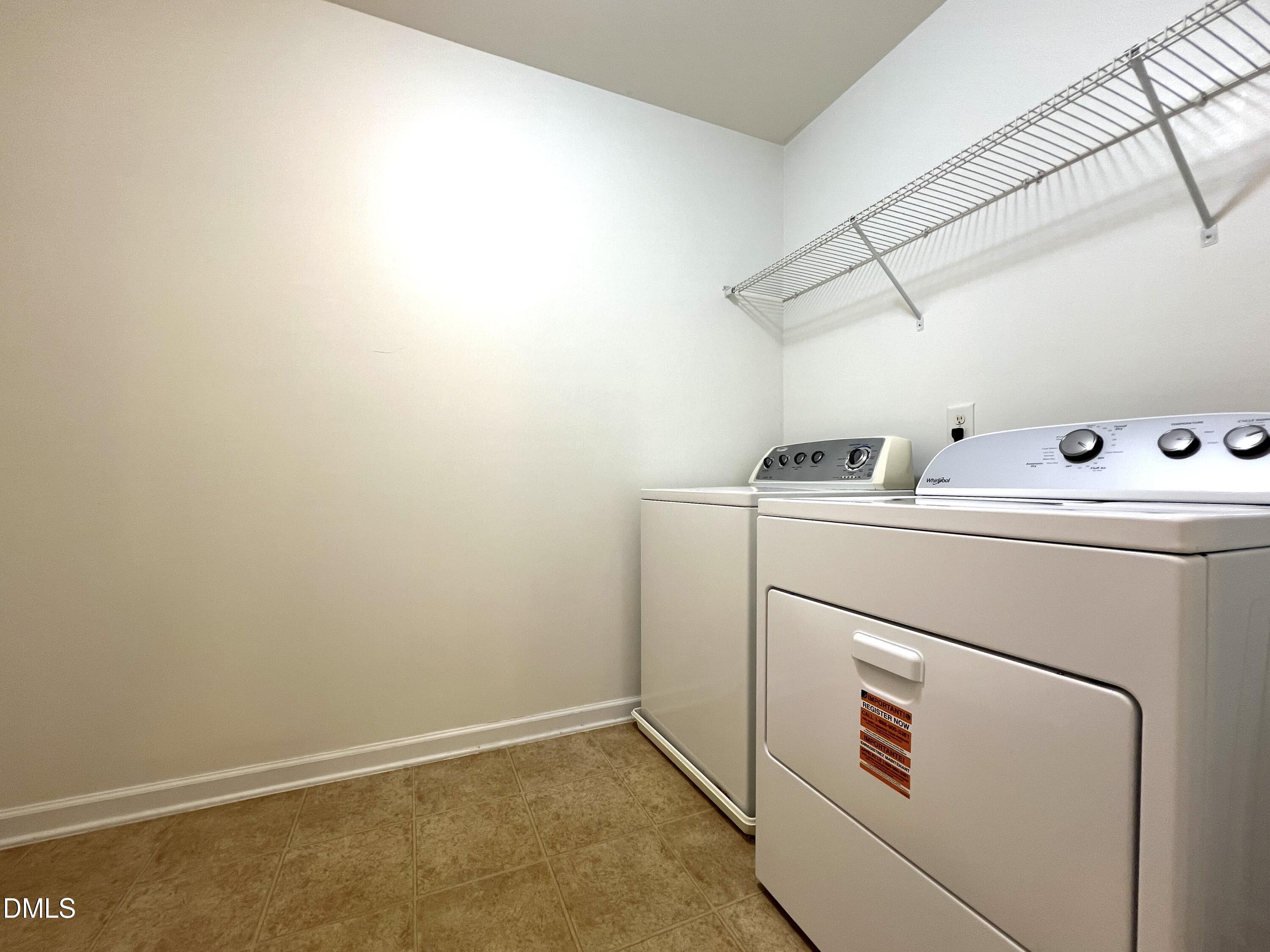 1495 Willowcrest Road Durham, NC 27703 - Photo 30 of 35 a utility room with dryer and washer