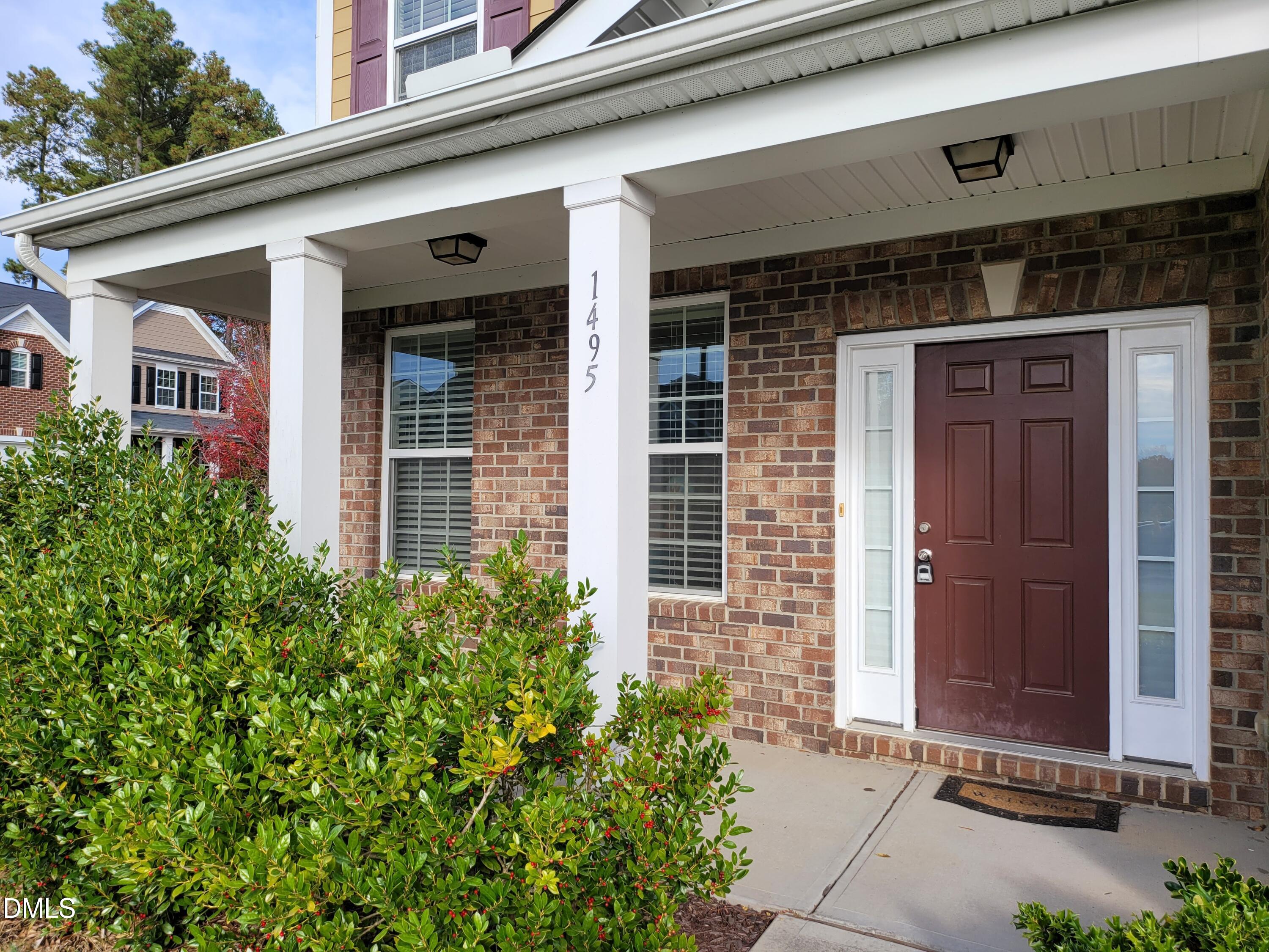 1495 Willowcrest Road Durham, NC 27703 - Photo 4 of 35 a front view of a house with a yard