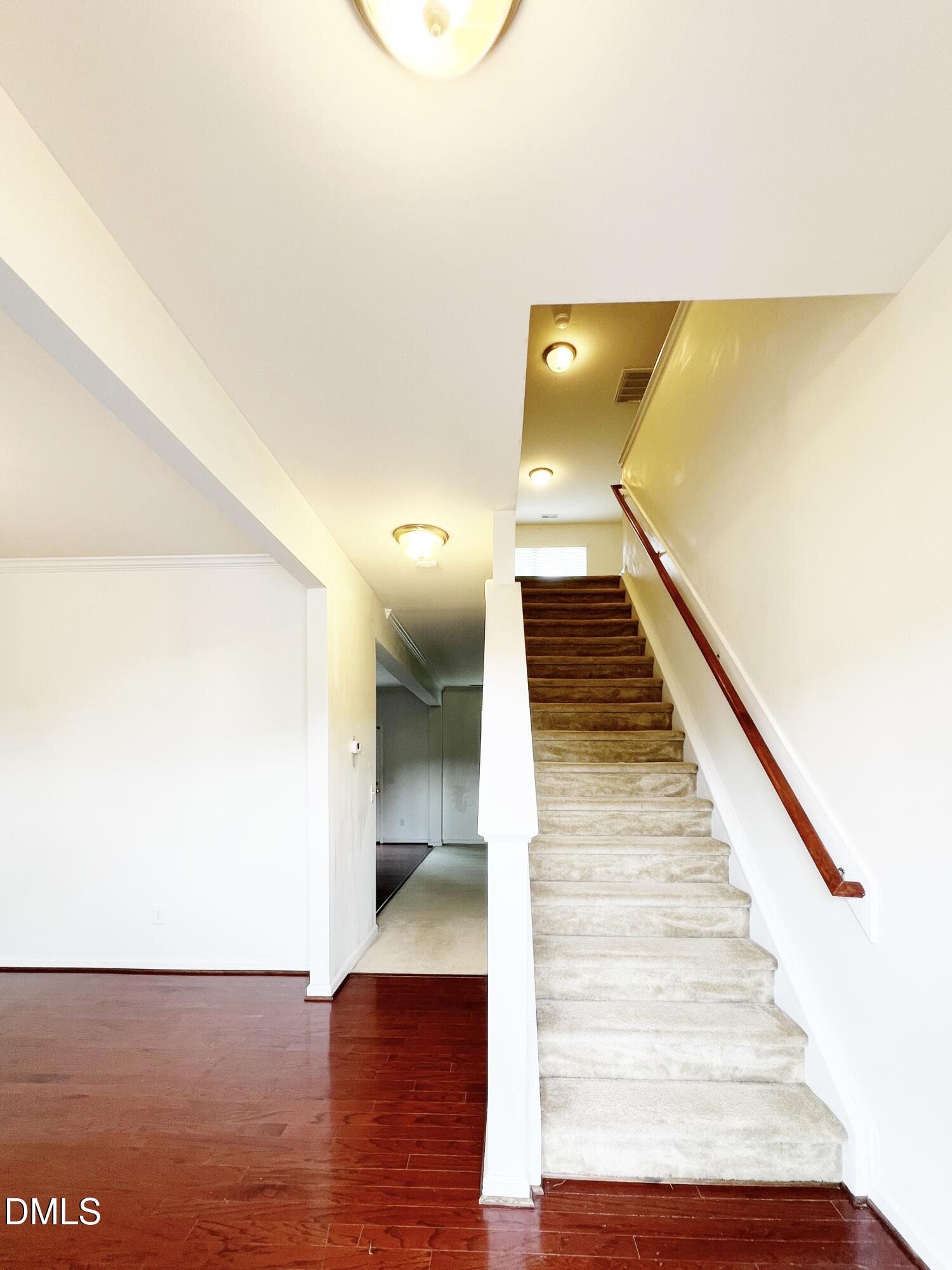 1495 Willowcrest Road Durham, NC 27703 - Photo 6 of 35 a view of entryway and hall with wooden floor