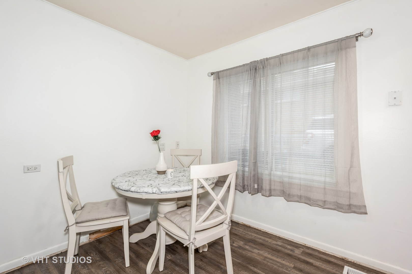 5117 Butterfield Road Hillside, IL 60162 - Photo 3 of 12 a dining room with furniture and wooden floor