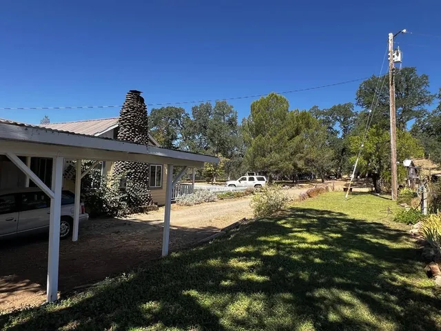 a view of a backyard of the house