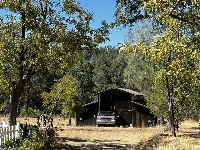 a view of a livingroom with furniture and a window