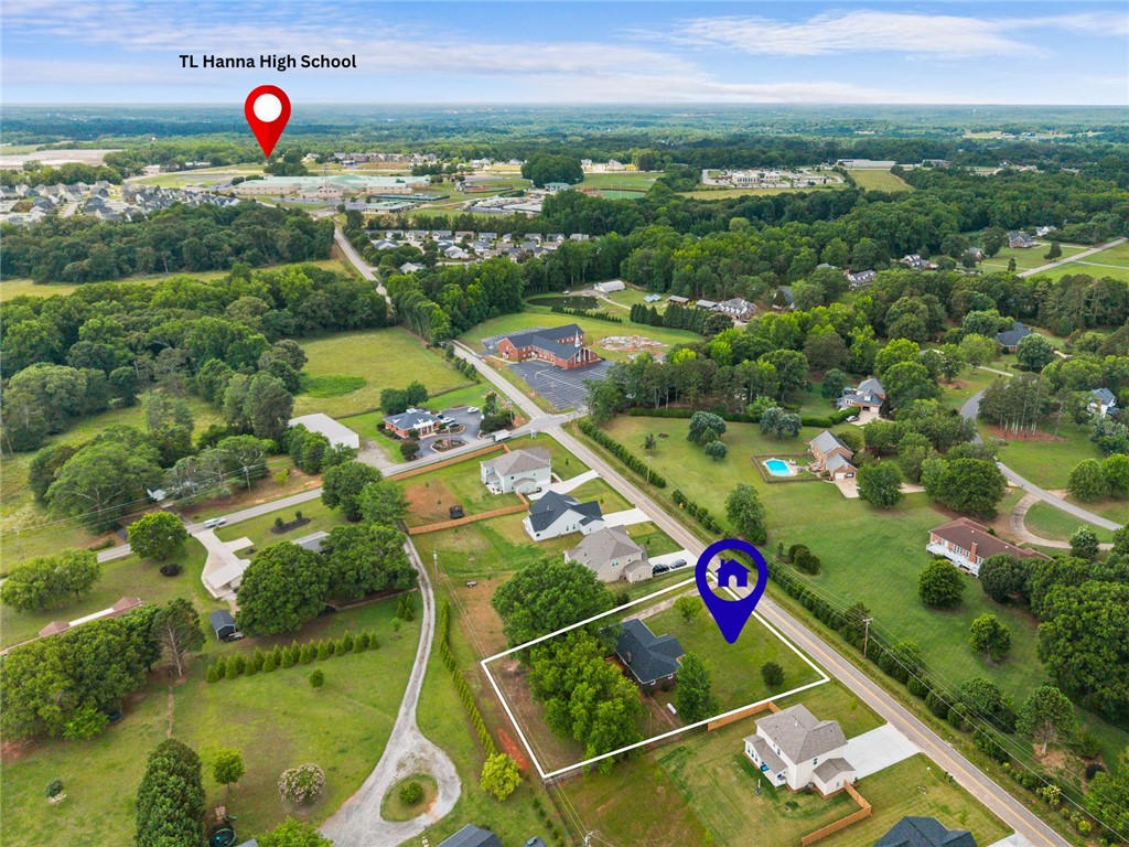 300 Vandiver Road Anderson, SC 29621 - Photo 29 of 30 An aerial perspective showcases a vibrant, green landscape dotted with residential homes and ample natural scenery.