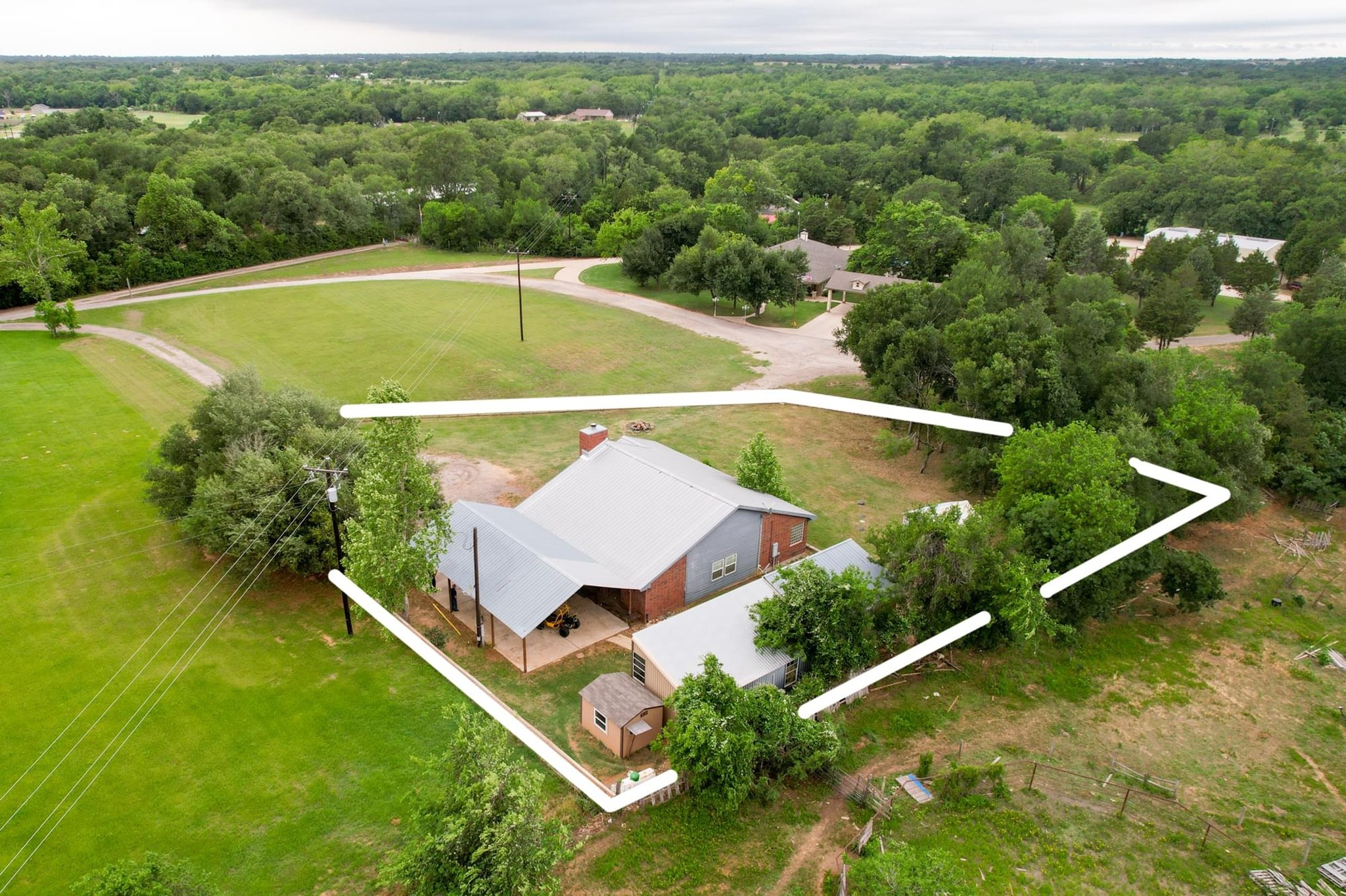 176 Old Lexington Road, Unit C Elgin, TX 78621 - Photo 25 of 31 an aerial view of a house with a yard