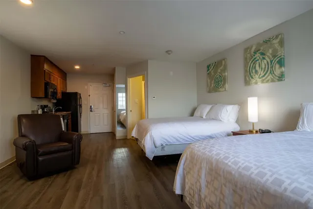 a bedroom with bed and a couch