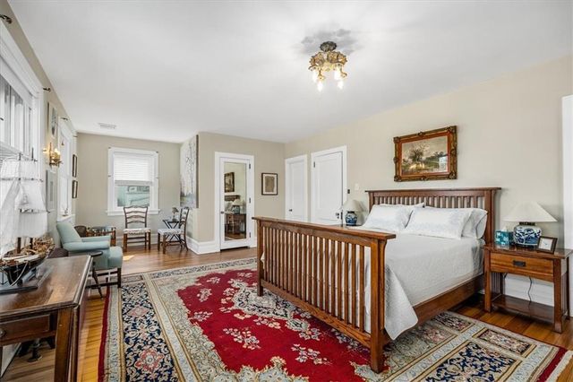 a spacious bedroom with a bed and a table