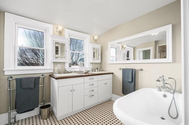 a bathroom with a sink a vanity and a mirror