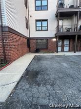803 Jackson Avenue, Unit A Bronx, NY 10456 - Photo 1 of 8 a view of a brick house with many windows