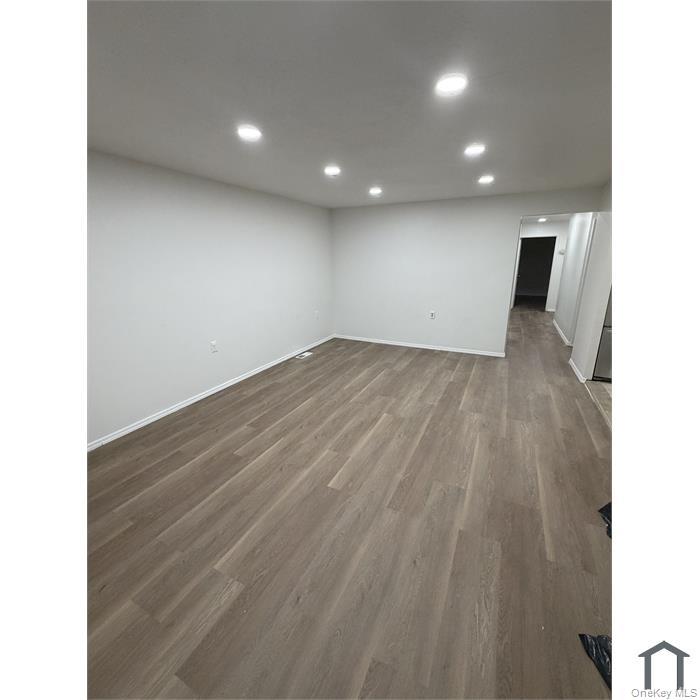 803 Jackson Avenue, Unit A Bronx, NY 10456 - Photo 2 of 8 a view of a livingroom with wooden floor