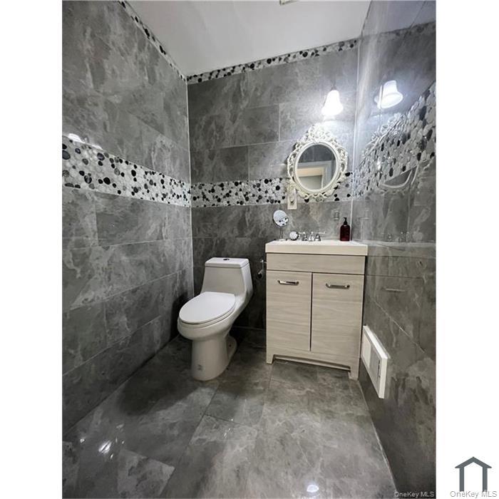 803 Jackson Avenue, Unit A Bronx, NY 10456 - Photo 4 of 8 a spacious bathroom with a sink toilet and shower