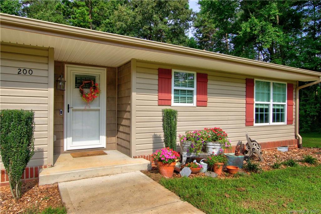 200 McCrary Road Mooresville, NC 28117 - Photo 2 of 41 a view of a house with a small yard and a large window