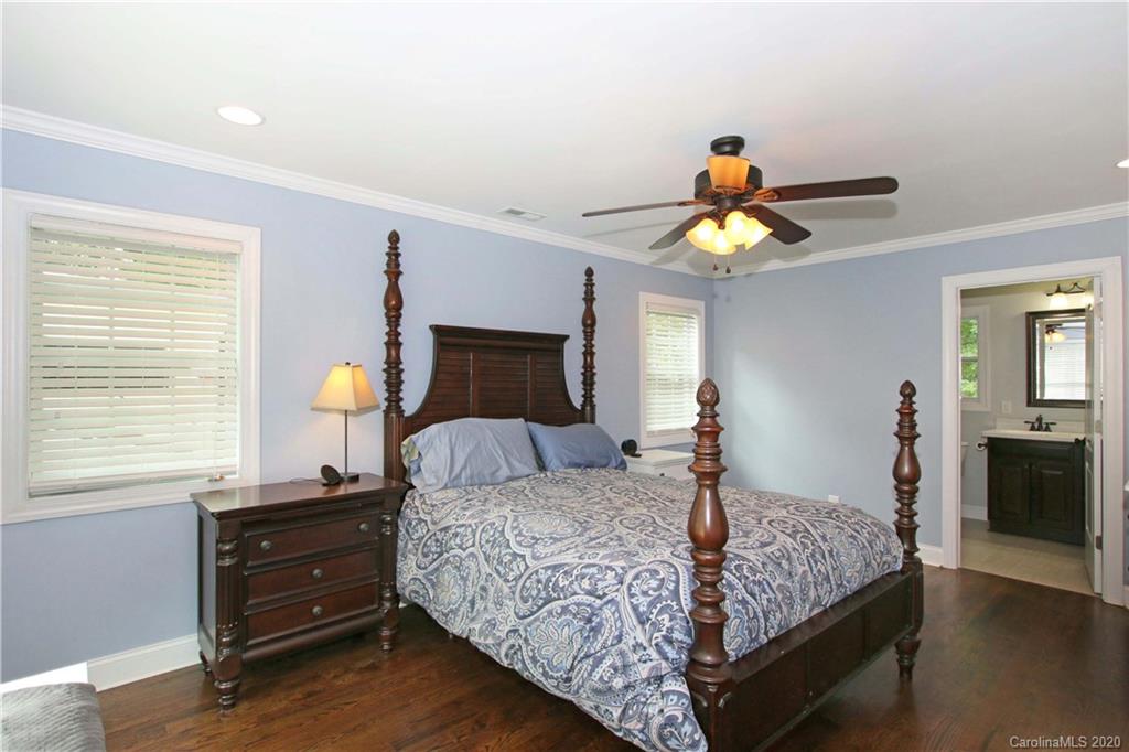 200 McCrary Road Mooresville, NC 28117 - Photo 11 of 41 a bedroom with a bed and a chandelier