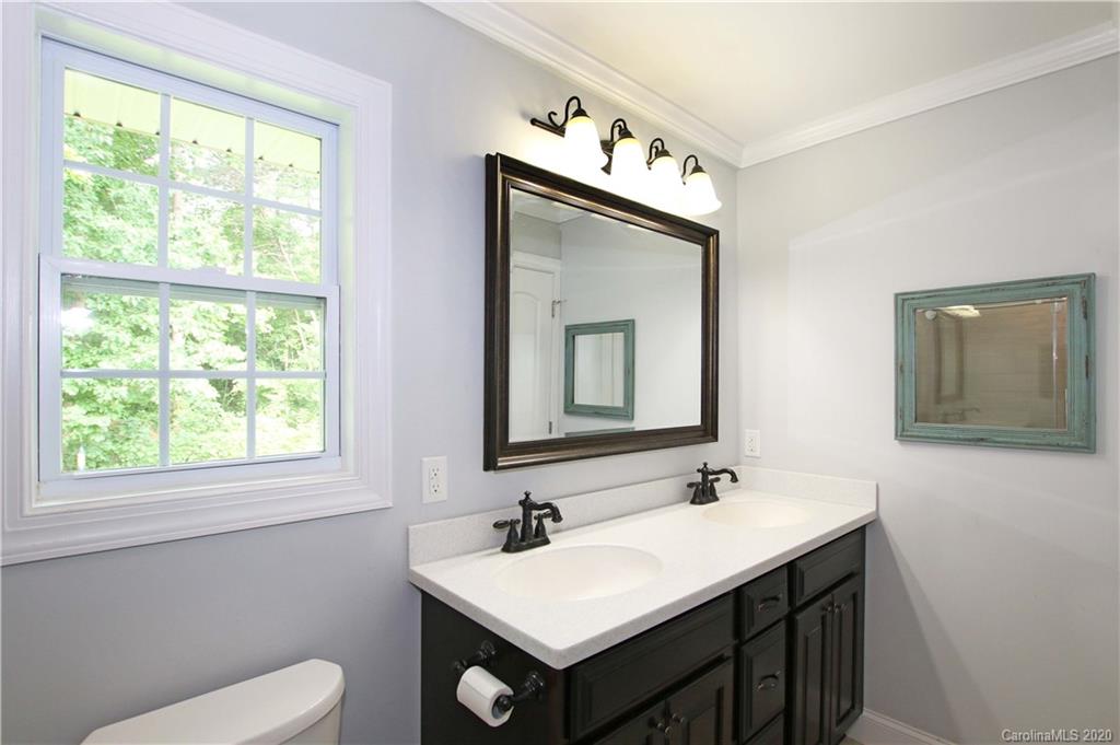 200 McCrary Road Mooresville, NC 28117 - Photo 12 of 41 a bathroom with a toilet sink and mirror