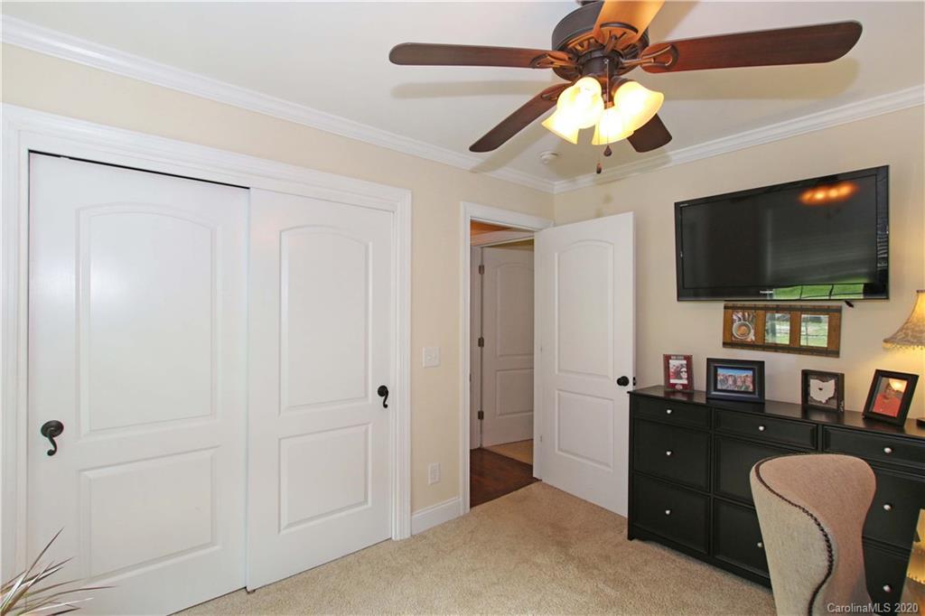 200 McCrary Road Mooresville, NC 28117 - Photo 14 of 41 a view of a livingroom with workspace and a flat screen tv