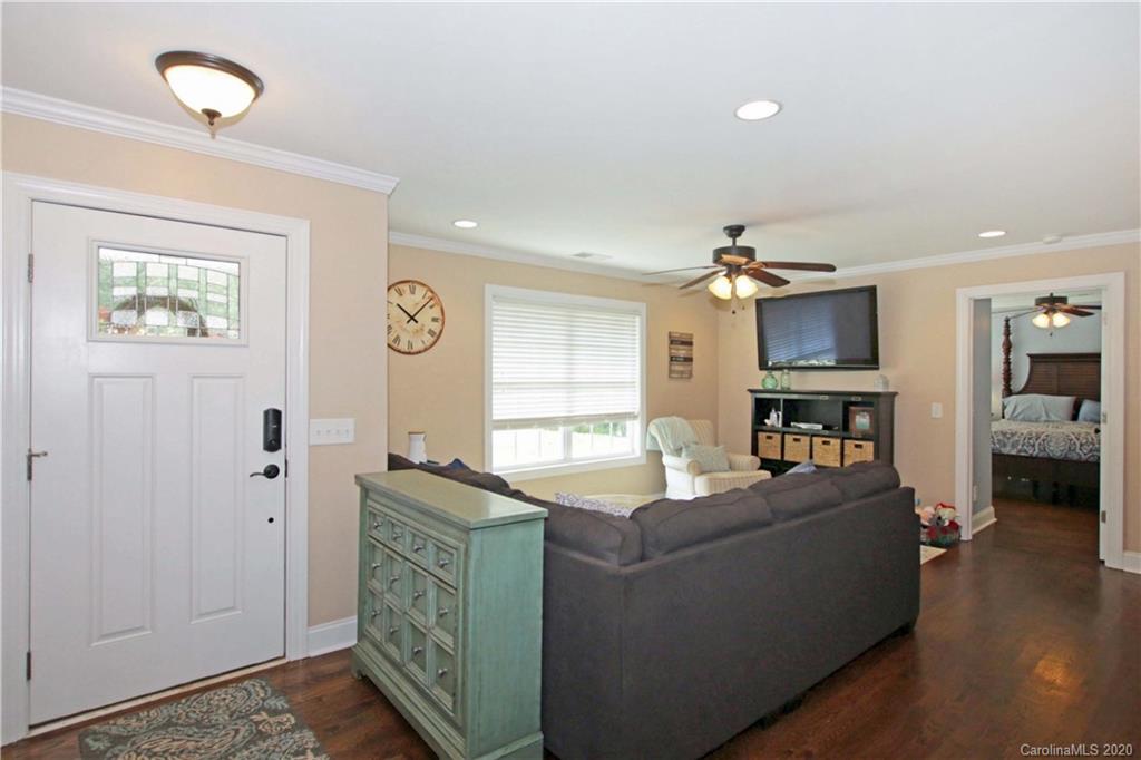 200 McCrary Road Mooresville, NC 28117 - Photo 3 of 41 a living room with furniture and a flat screen tv