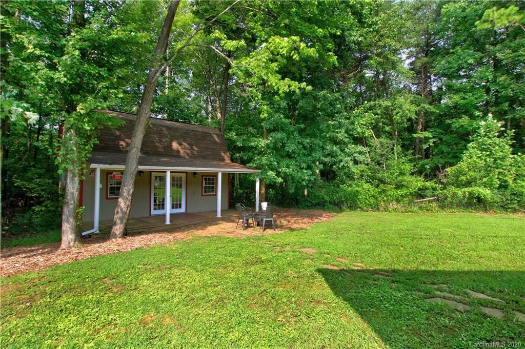 200 McCrary Road Mooresville, NC 28117 - Photo 29 of 41 a view of a house with backyard sitting area and garden