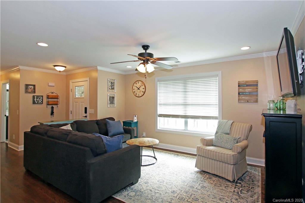 200 McCrary Road Mooresville, NC 28117 - Photo 4 of 41 a living room with furniture a chandelier and a window