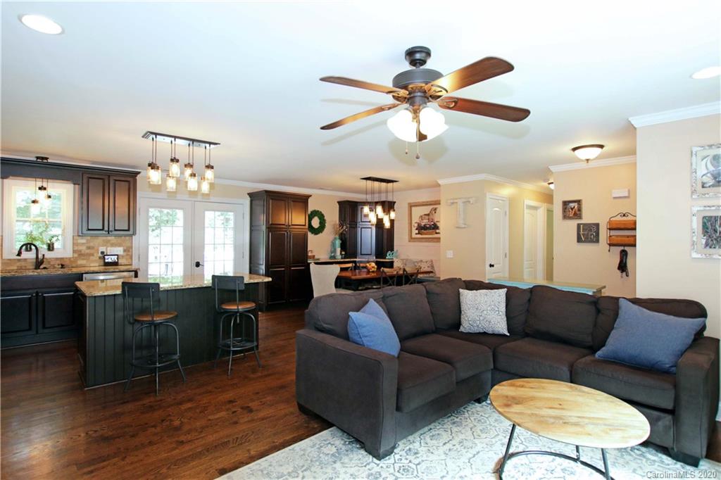 200 McCrary Road Mooresville, NC 28117 - Photo 5 of 41 a view of a dining room with furniture window and wooden floor