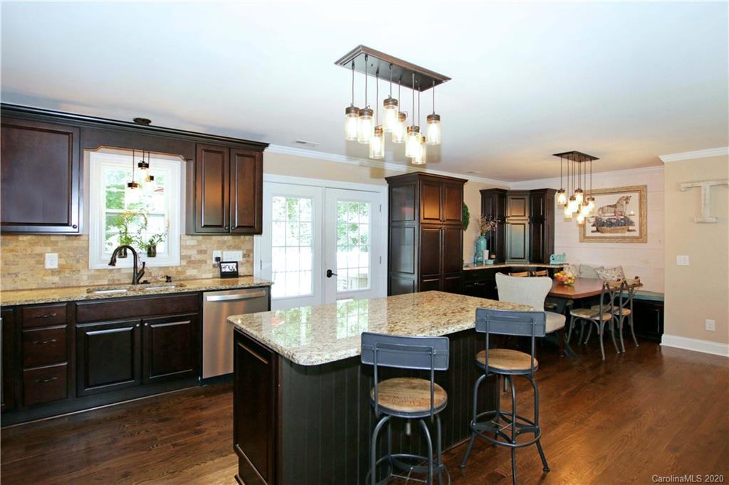 200 McCrary Road Mooresville, NC 28117 - Photo 8 of 41 a view of a dining room with furniture and wooden floor