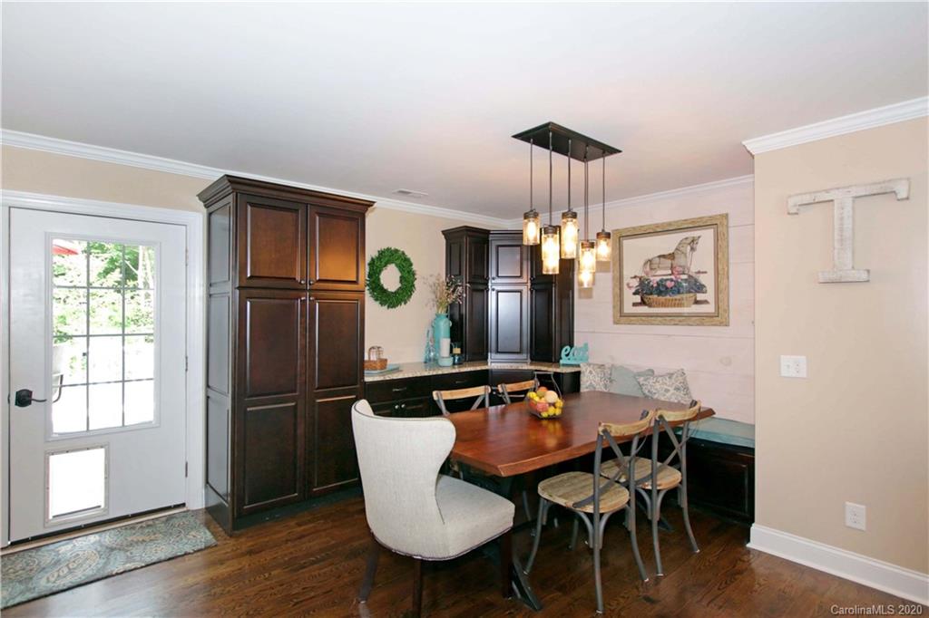 200 McCrary Road Mooresville, NC 28117 - Photo 10 of 41 a view of a dining room with furniture window and wooden floor