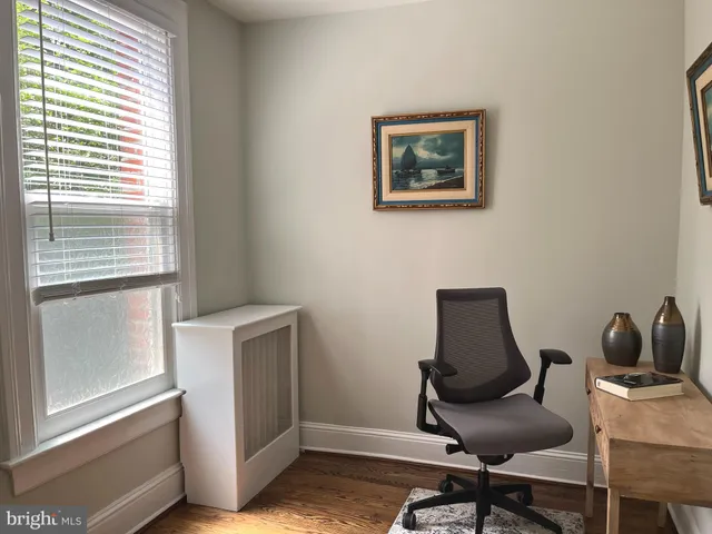 a work room with furniture and windows