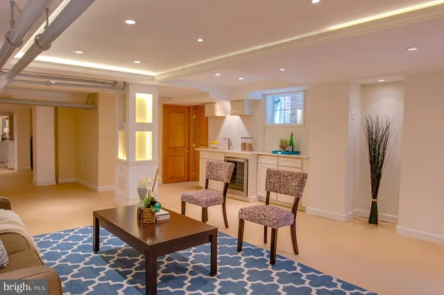 a living room with furniture and a table