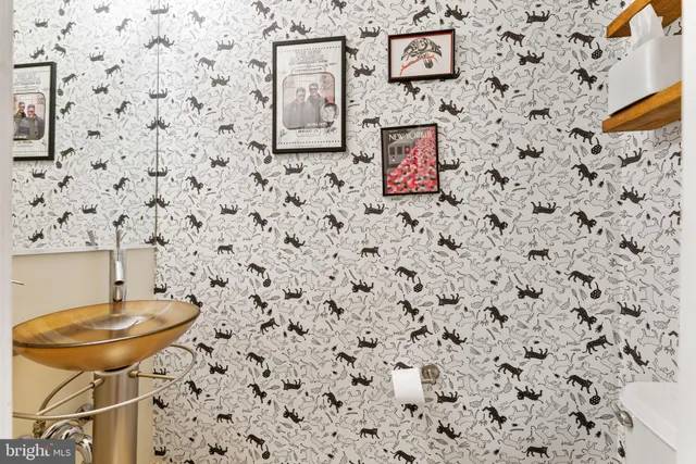 a kitchen with stainless steel appliances a refrigerator sink and microwave