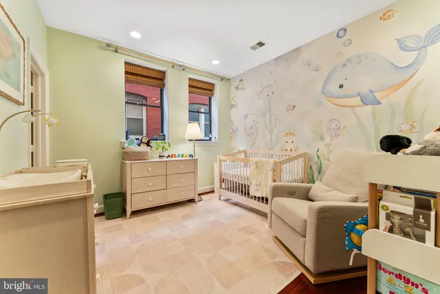a view of a hallway with washer and dryer