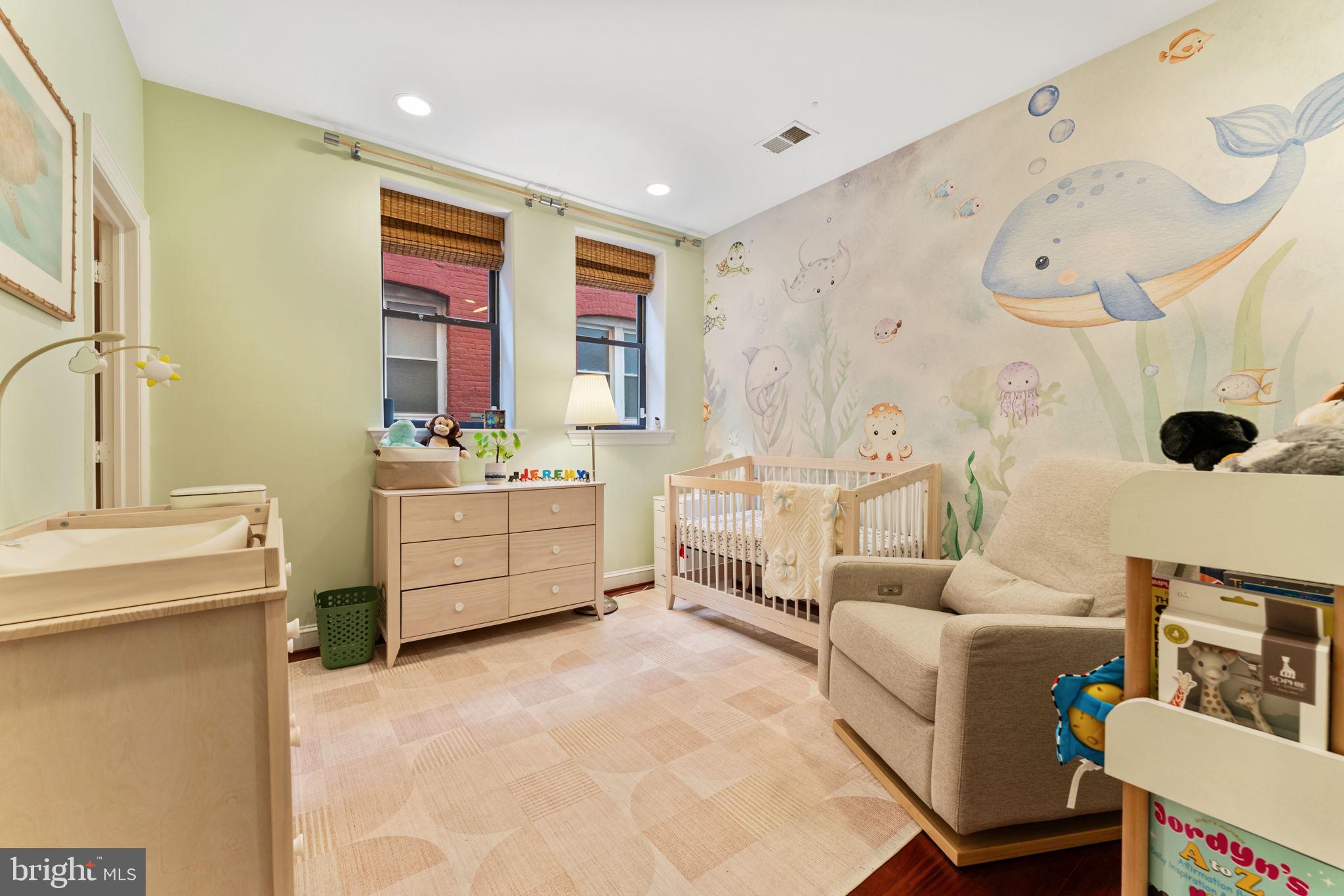 1105 Park Road Northwest, Unit 3 Washington, DC 20010 - Photo 12 of 20 a living room with furniture and a large window