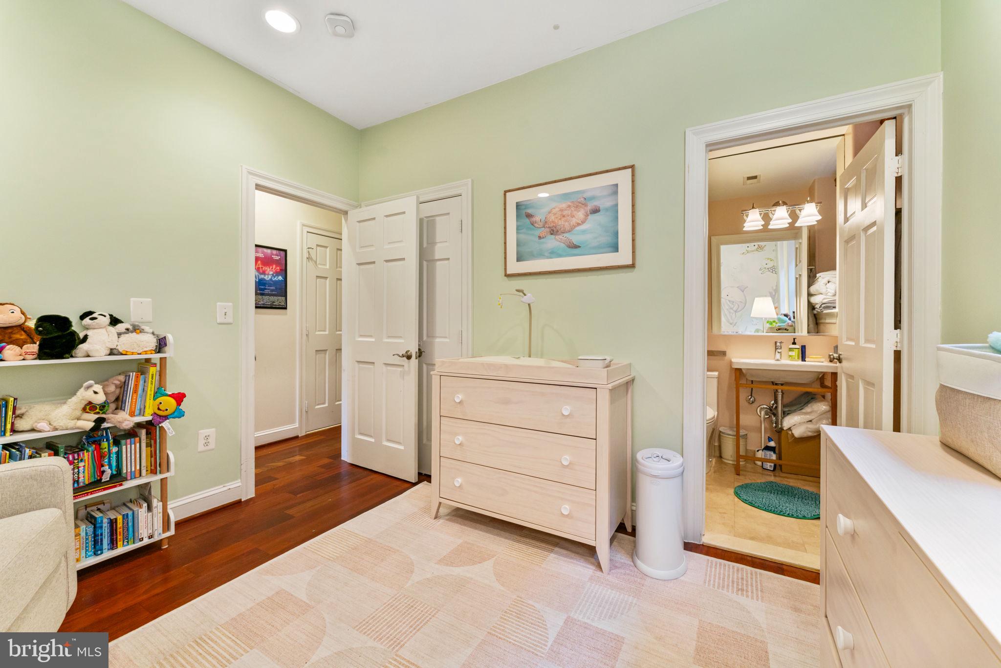 1105 Park Road Northwest, Unit 3 Washington, DC 20010 - Photo 13 of 20 a room with a baby crib and dresser