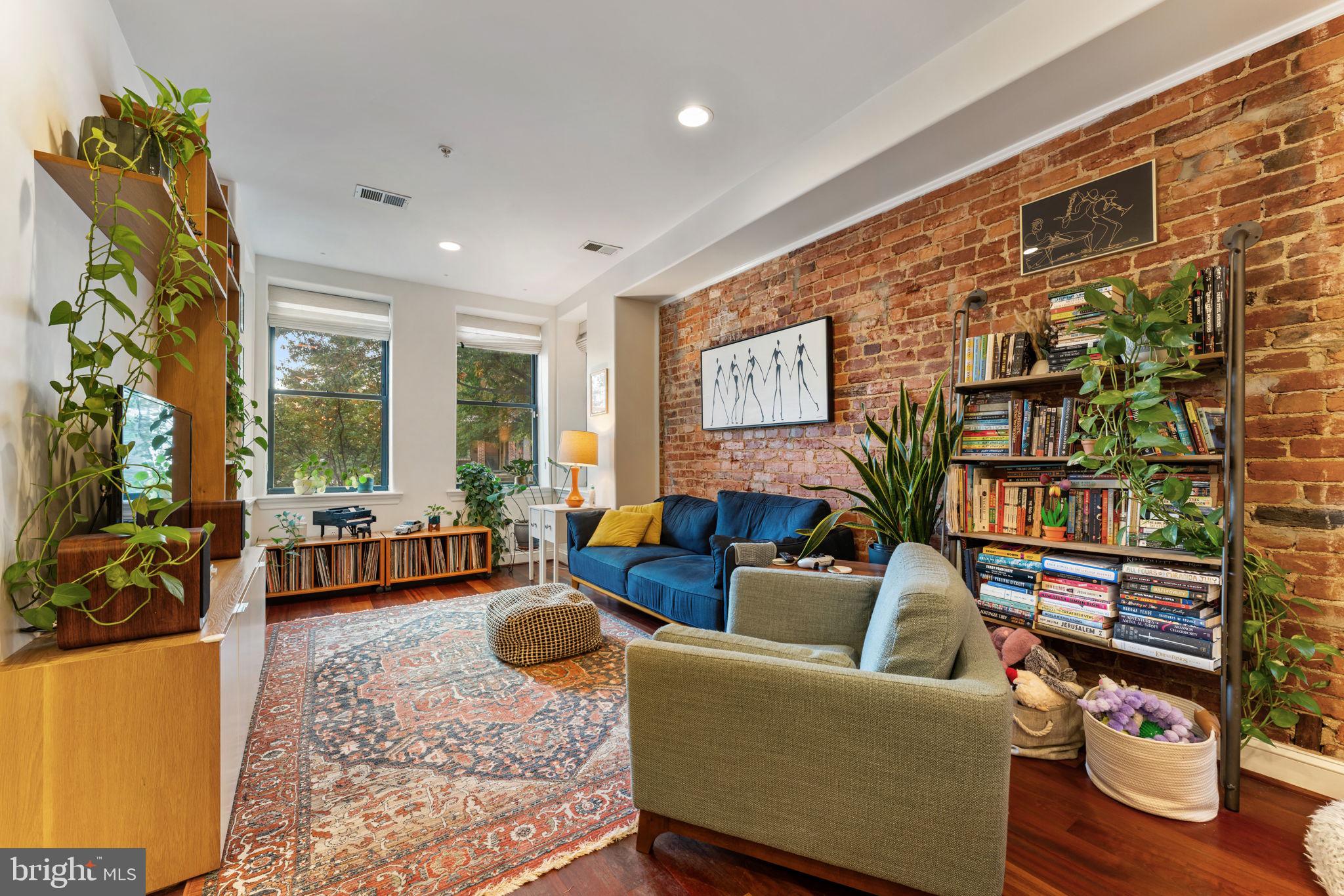 1105 Park Road Northwest, Unit 3 Washington, DC 20010 - Photo 4 of 20 a living room with furniture and a large window