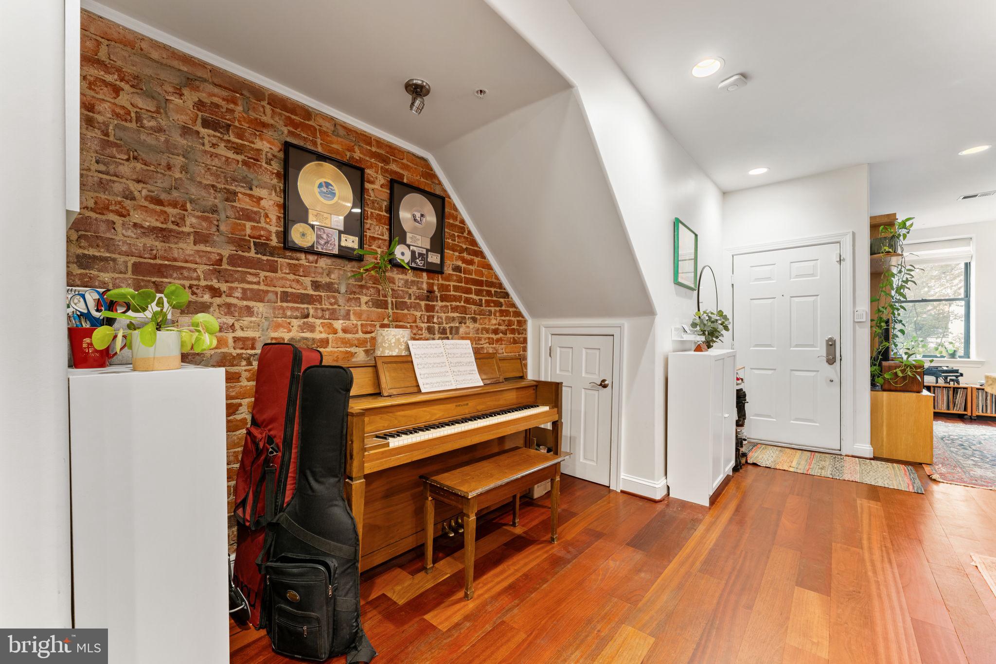 1105 Park Road Northwest, Unit 3 Washington, DC 20010 - Photo 7 of 20 a living room with furniture and a wooden floor