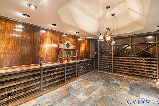 a view of a hallway with wooden cabinets