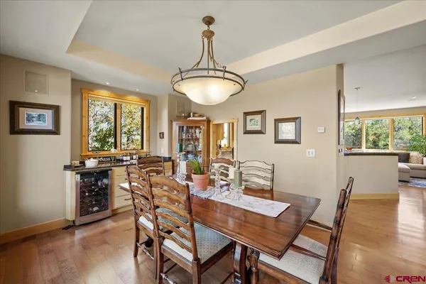a view of a dining room with furniture window and wooden floor