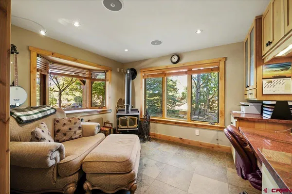 a spacious bedroom with a large bed and large windows