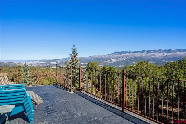 a view of a balcony with an ocean view