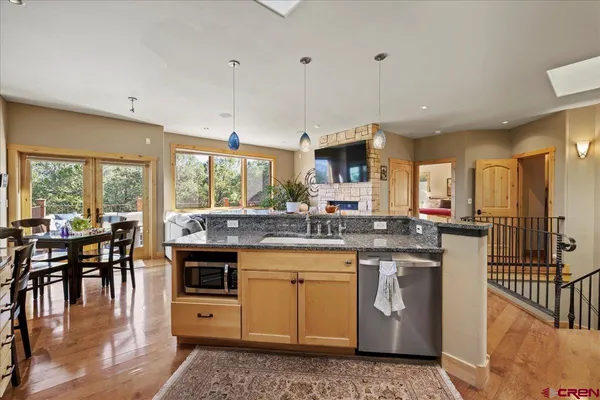 a kitchen with lots of counter top space and appliances