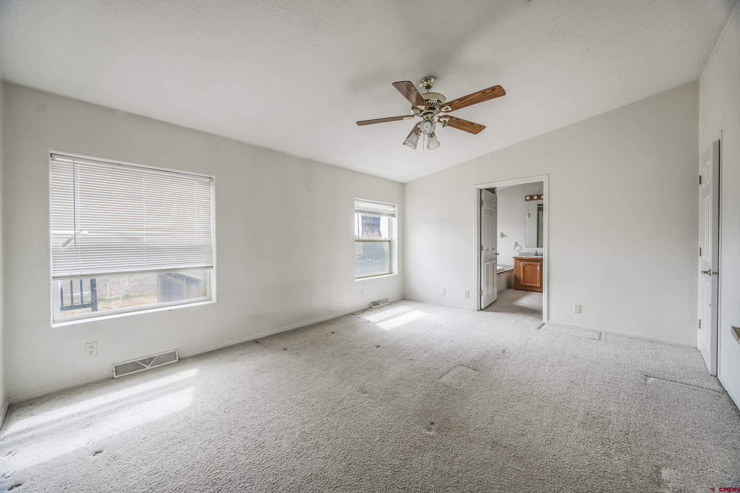 17377 Breeze Road Delta, CO 81416 - Photo 23 of 45 a view of empty room with windows