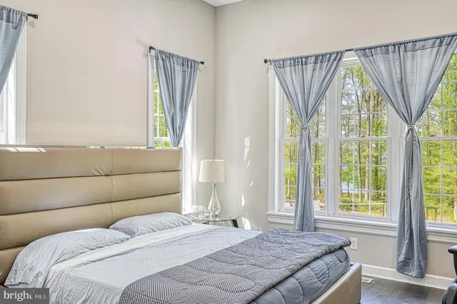 a bathroom with a tub shower and sink