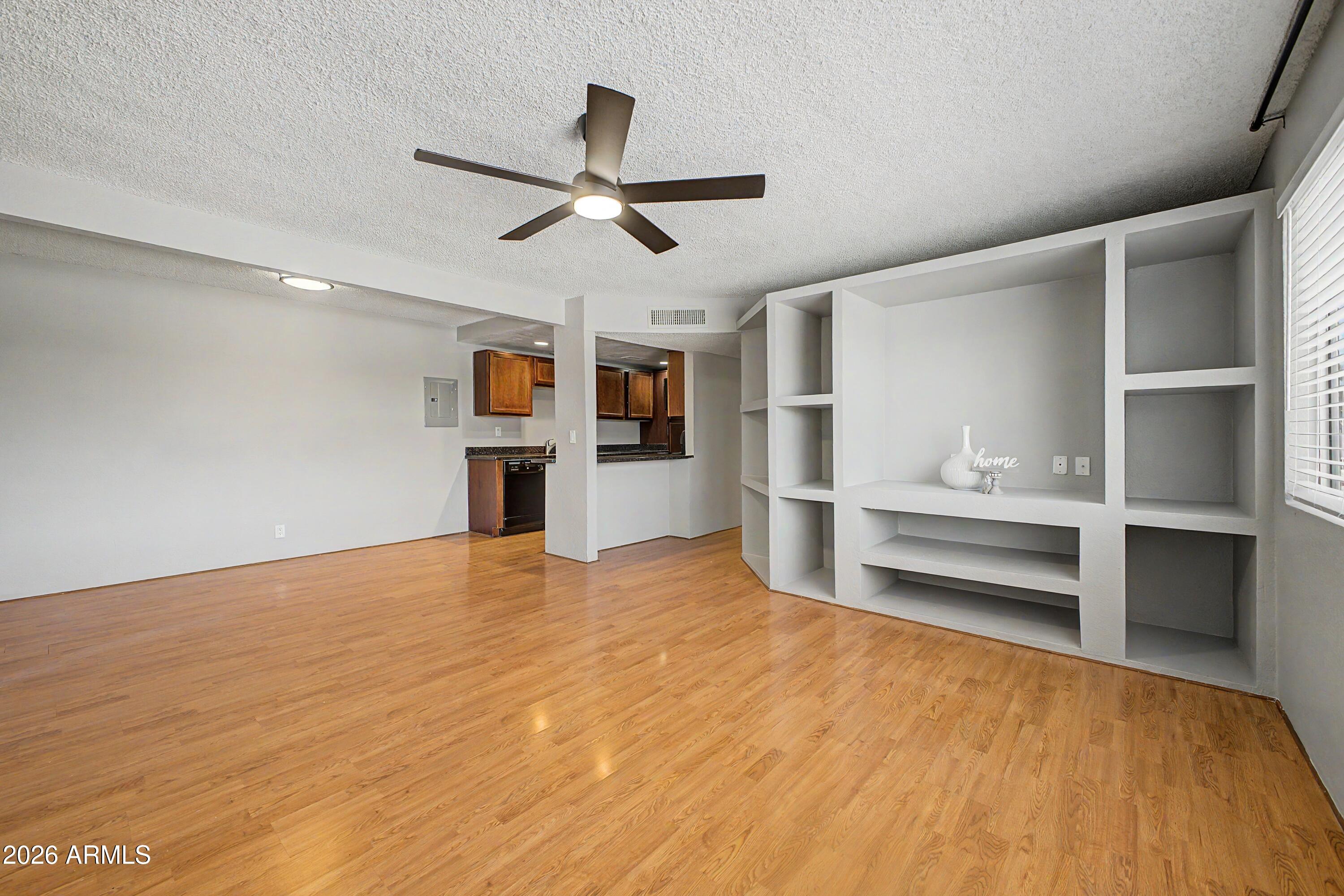 424 West Brown Road, Unit 248 Mesa, AZ 85201 - Photo 5 of 19 a view of empty room with wooden floor and window