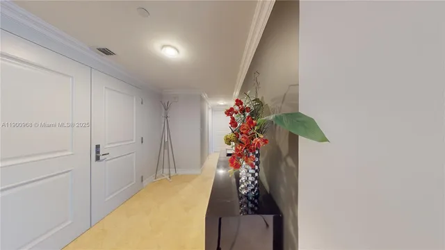 a spacious bedroom with a bed and wooden floor