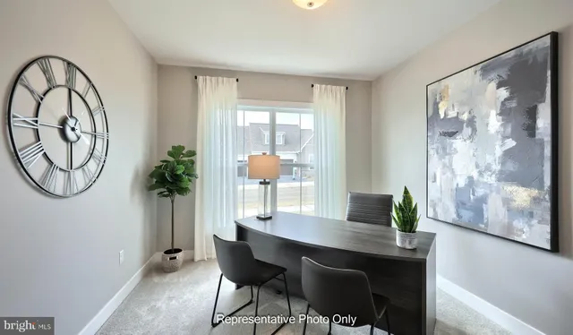 a workspace with furniture and window