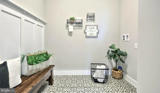 a room with painting and flower pot