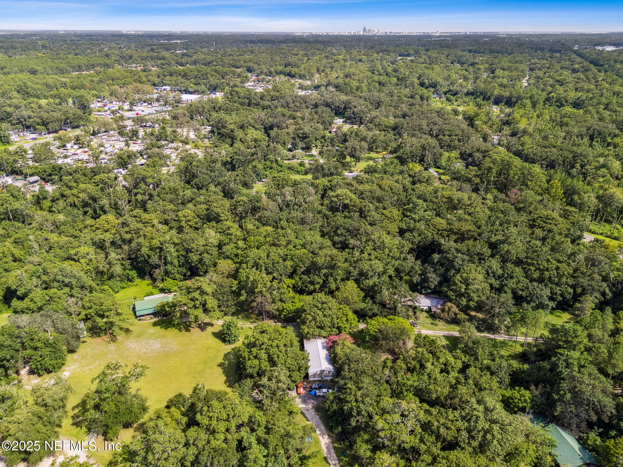 0 Moncrief Dinsmore Road Jacksonville, FL 32219 - Photo 18 of 25 a view of a city with lush green forest