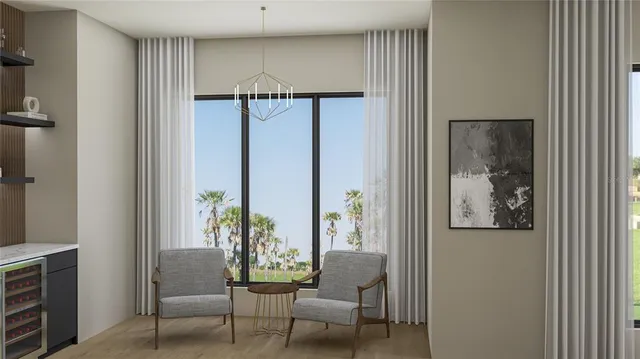 a view of a hallway with furniture and a potted plant