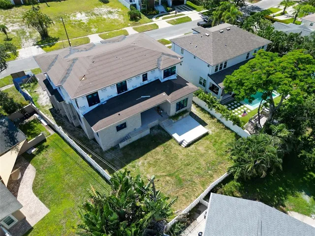 an aerial view of house with a yard